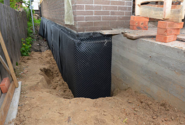 Happy homeowners after waterproofing job in Wyandotte